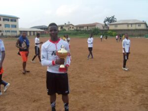 Uchenna Christian with a trophy